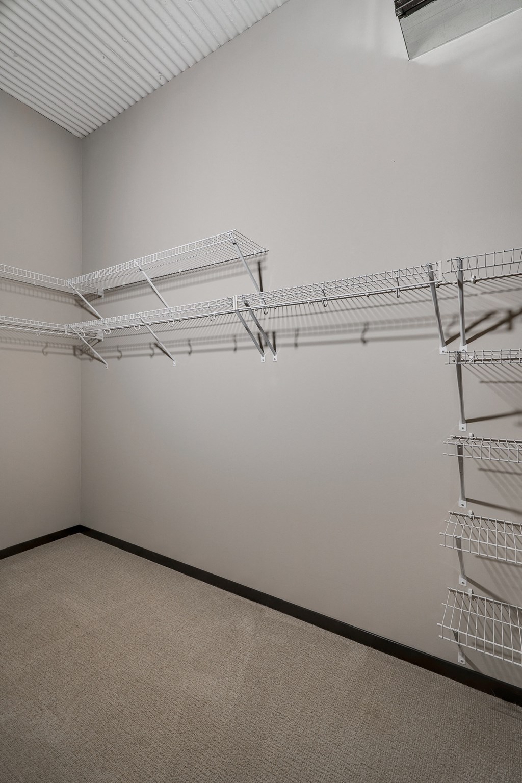 Large Walk-In Closet with Multiple Built-In Shelves