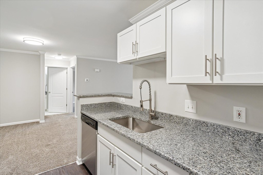 Kitchen with White Cabinetry and Stainless Steel Appliances