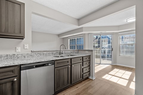 Kitchen with Dark Brown Cabinetry and Stainless Steel Appliances