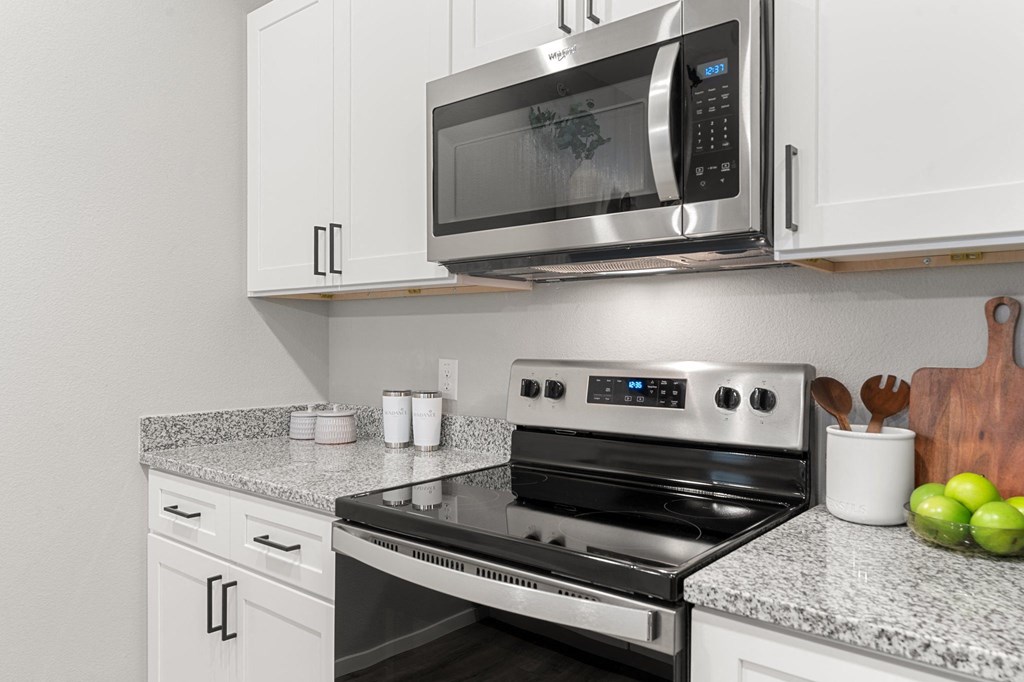 Kitchen with White Cabinetry and Stainless Steel Appliances
