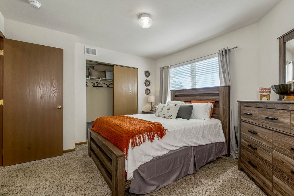 Cartpeted Bedroom With Large Windows