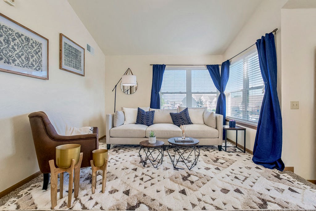 Inviting Living Room Area With Lots Of Windows