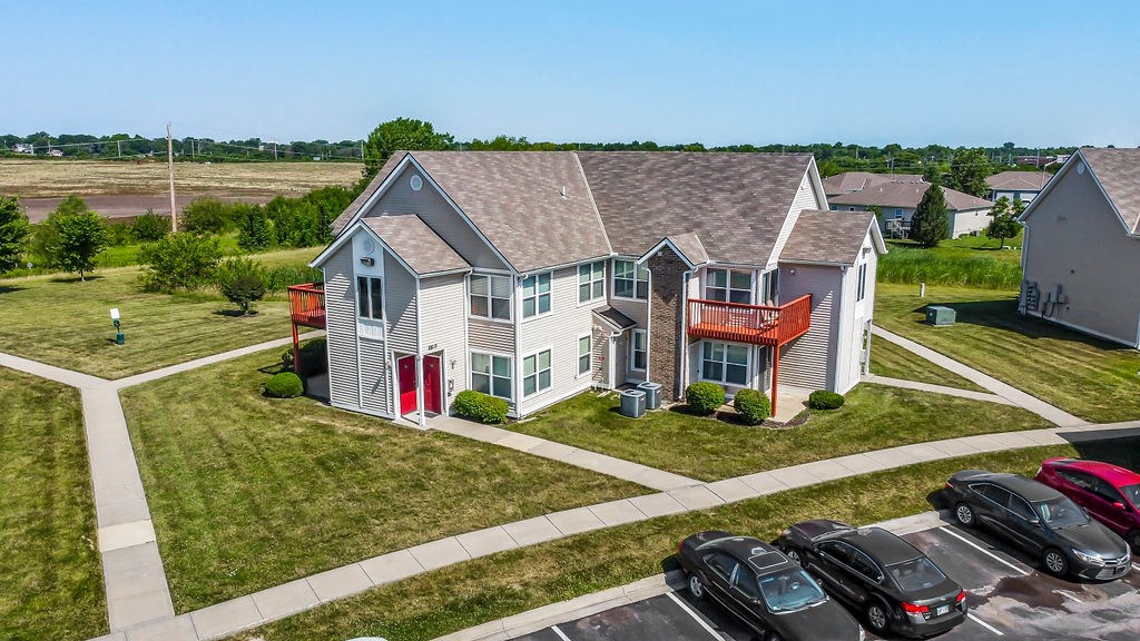 Aerial View Of An Apartment Building With Spacious Balconies