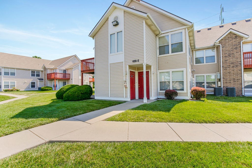 Sidewalk Leading Up To Apartment Homes Featuring Private Entrances
