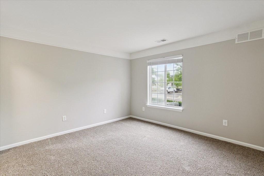Spacious Bedroom with Plush Carpeting