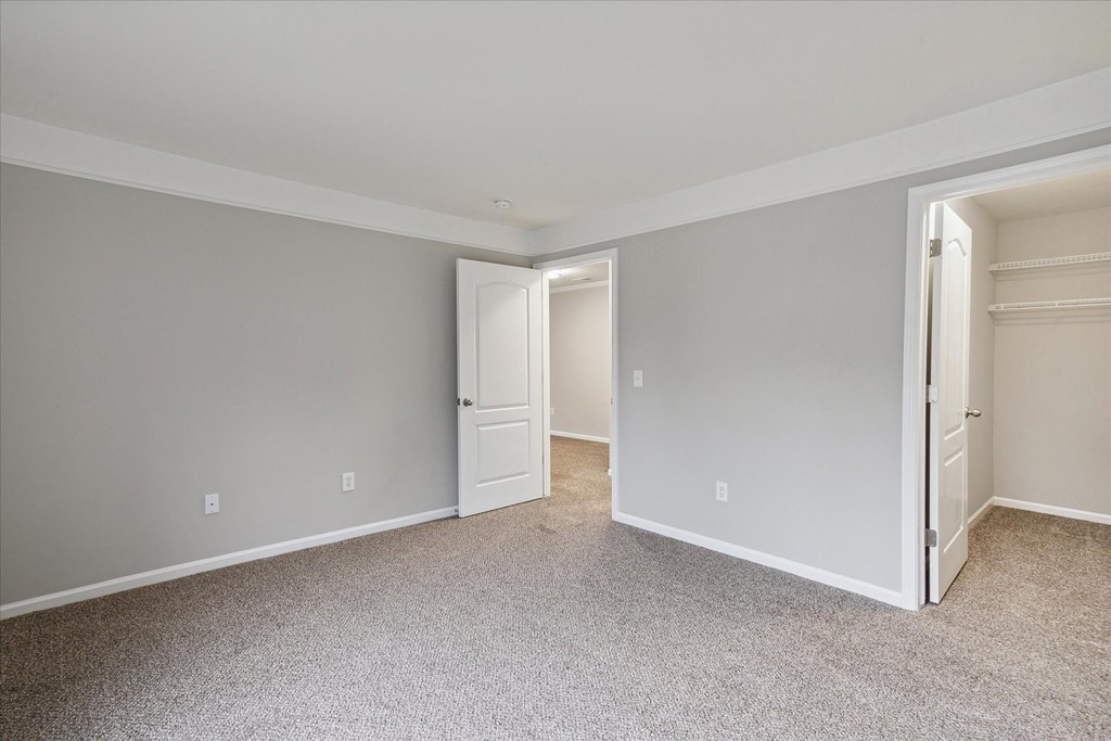 Spacious Bedroom with Plush Carpeting
