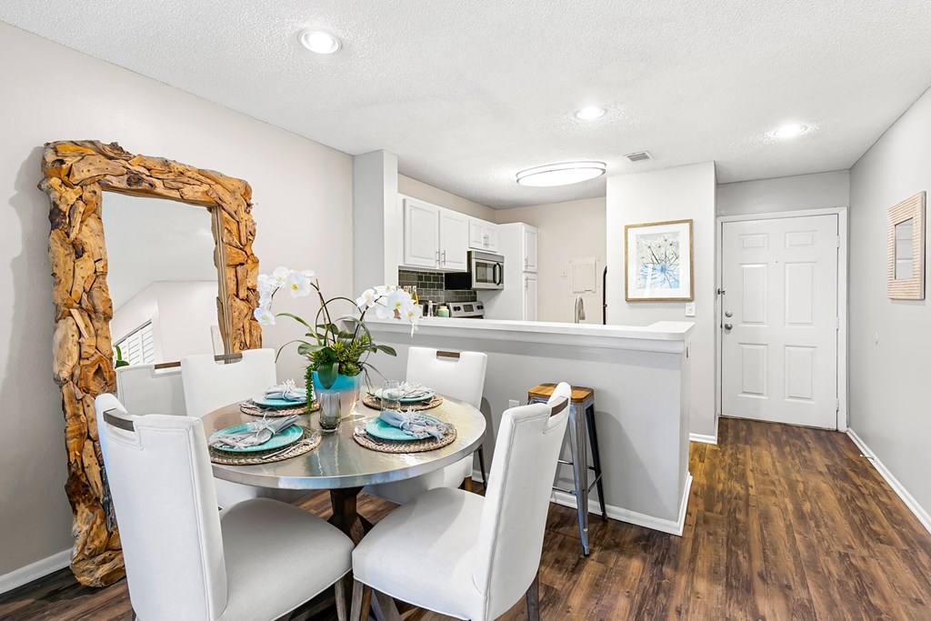 Open Concept Kitchen & Dining Room Area With Wood-Style Flooring