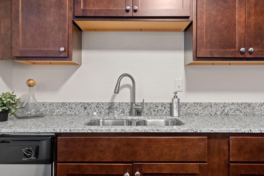 Kitchen with Dark Brown Cabinetry and Stainless Steel Appliances