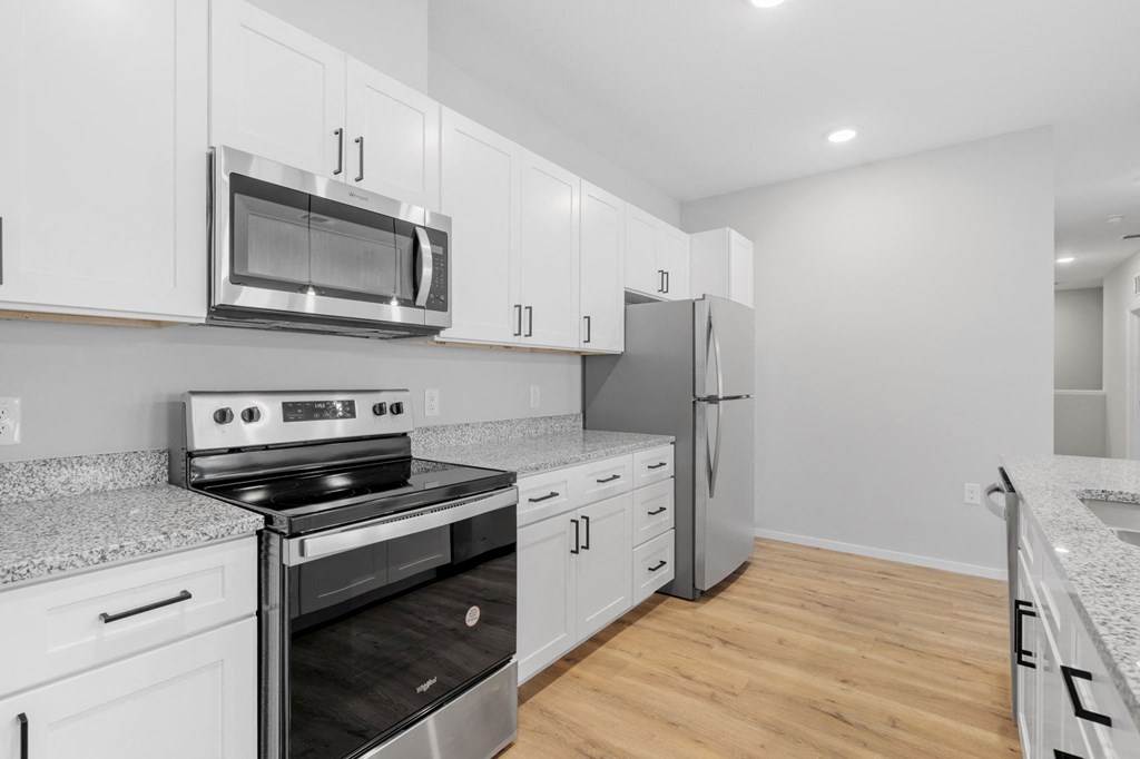 Kitchen with White Cabinetry and Stainless Steel Appliances