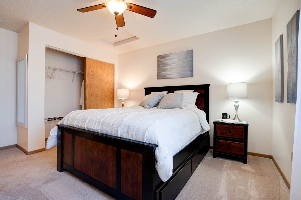Bedroom With Ceiling Fan & Sliding Closet Door