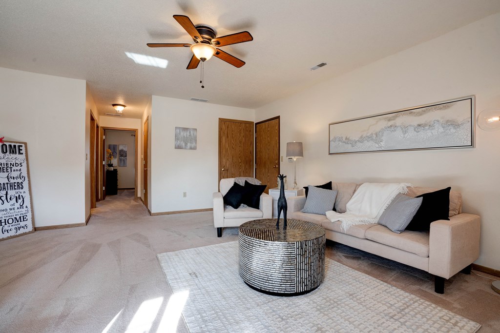 Living Room With Carpeted Hallway
