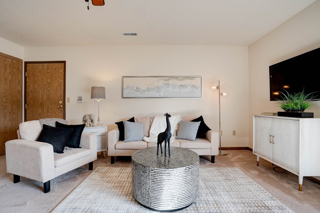 Carpeted Living Room With Light Beige Walls