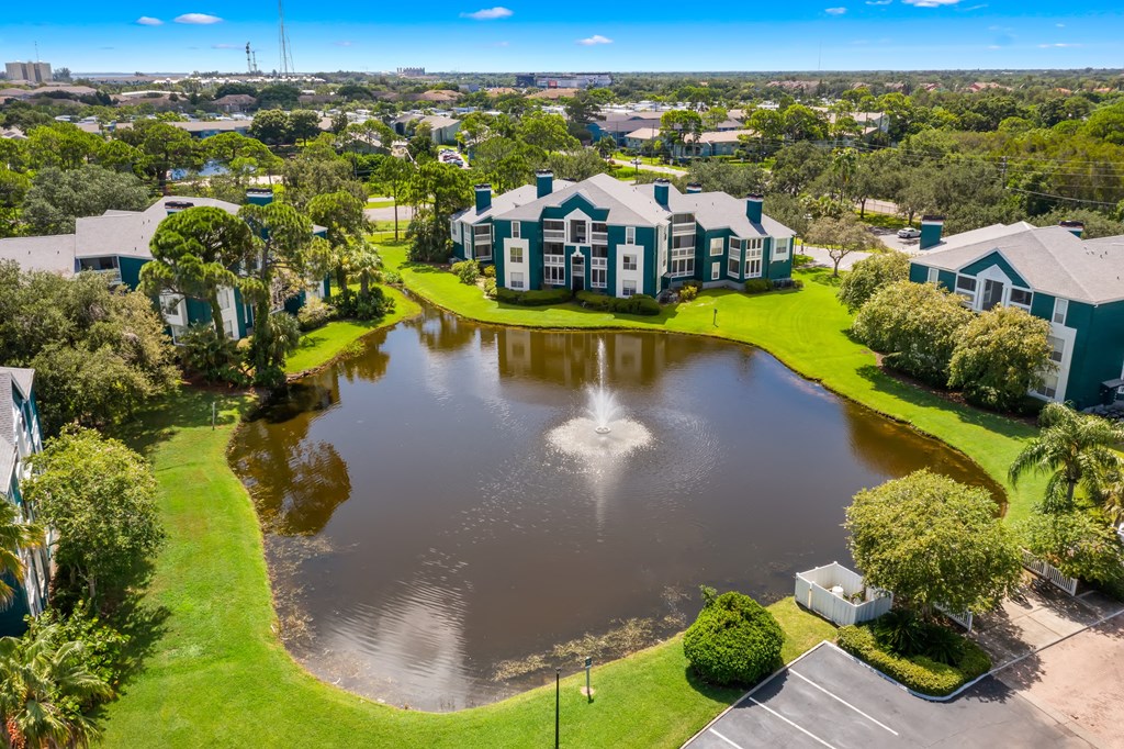 Aerial View Of Apartment Homes Overlooking The Pond & Fountain