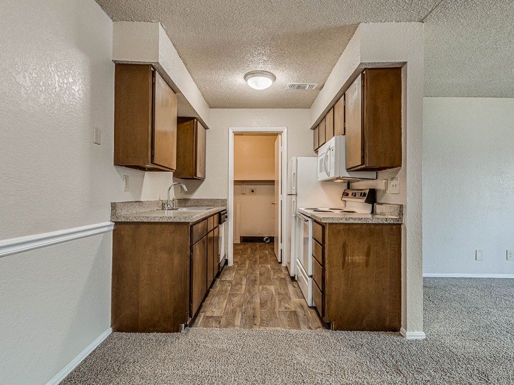 Kitchen with Wood Cabinetry and Granite Countertops