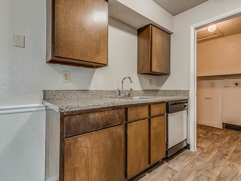 Kitchen with Wood Cabinetry and Granite Countertops