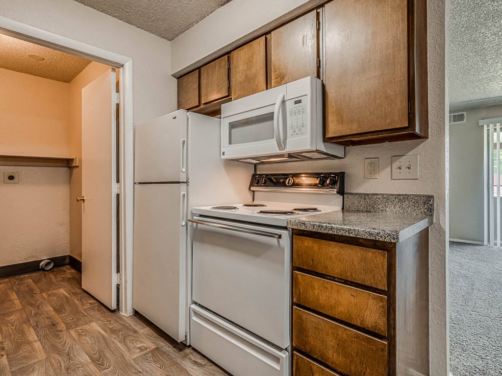 Kitchen with Wood Cabinetry and Granite Countertops