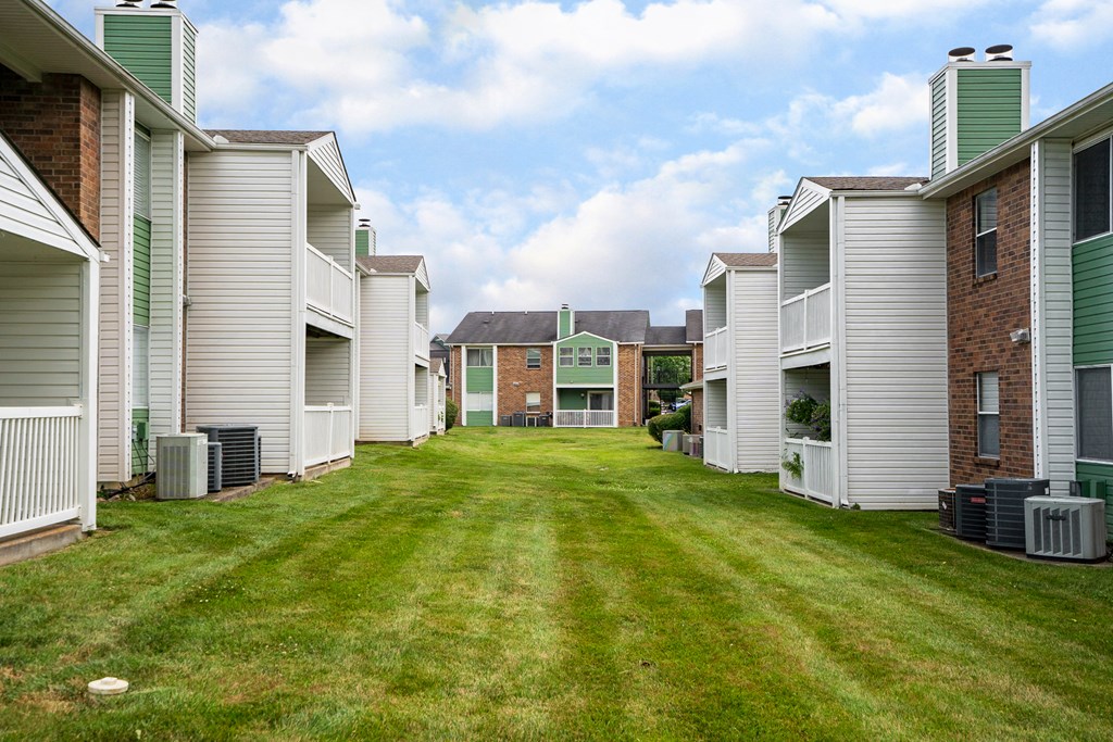 Green Grass Area Between Rivergate Meadows Apartment Homes