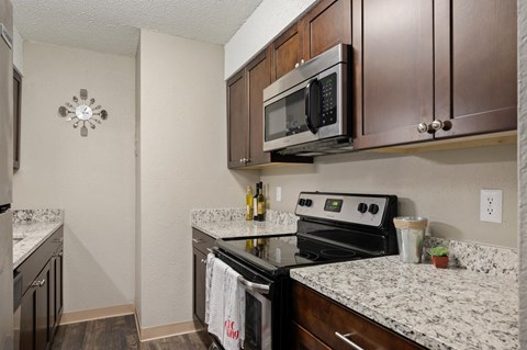 our apartments offer a kitchen with stainless steel appliances and granite counter tops