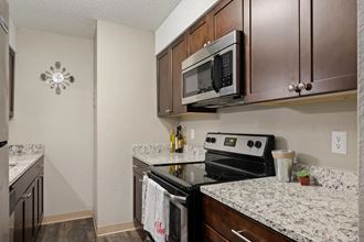 Renovated Kitchen With Espresso Cabinets, Granite Counters & Stainless Steel Appliances