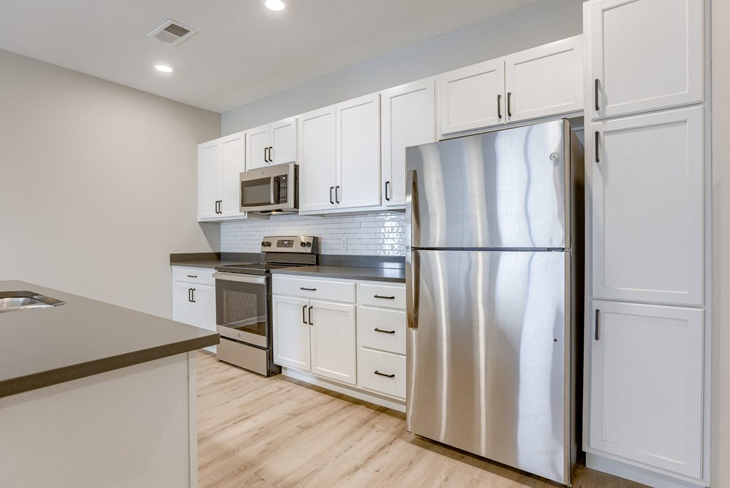 Kitchen with White Cabinetry and Stainless Steel Appliances