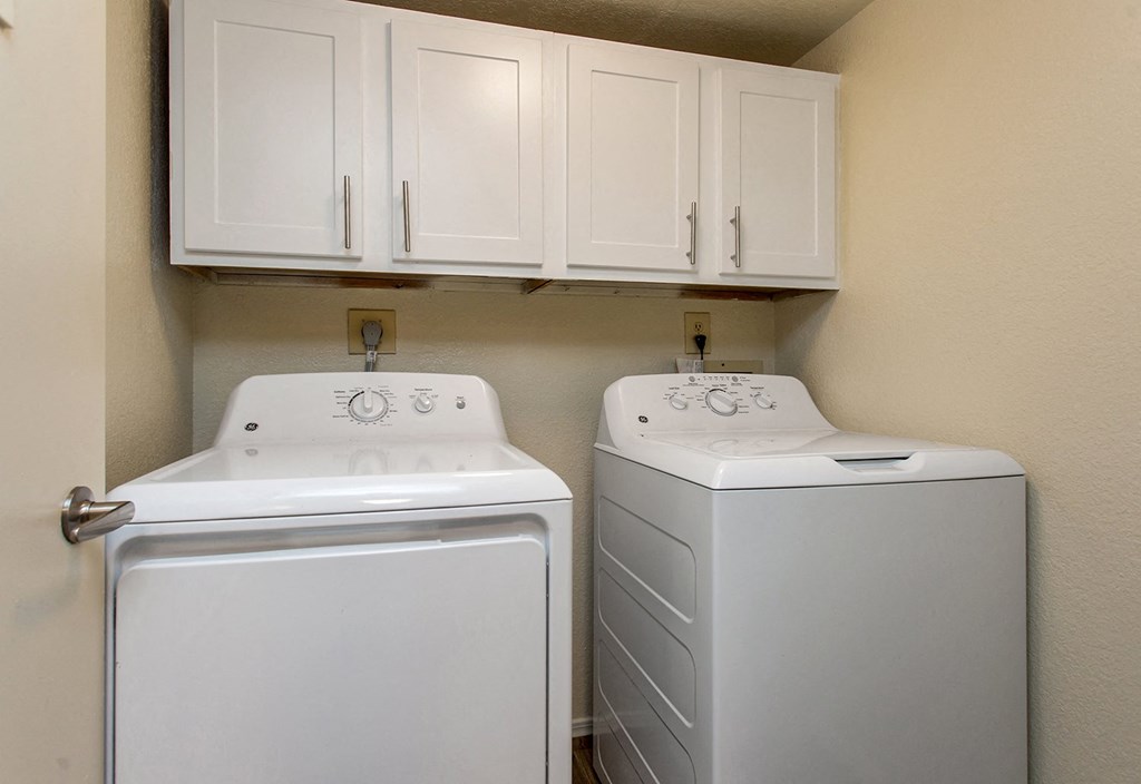Washer & Dryer With Built-In Cabinets Above