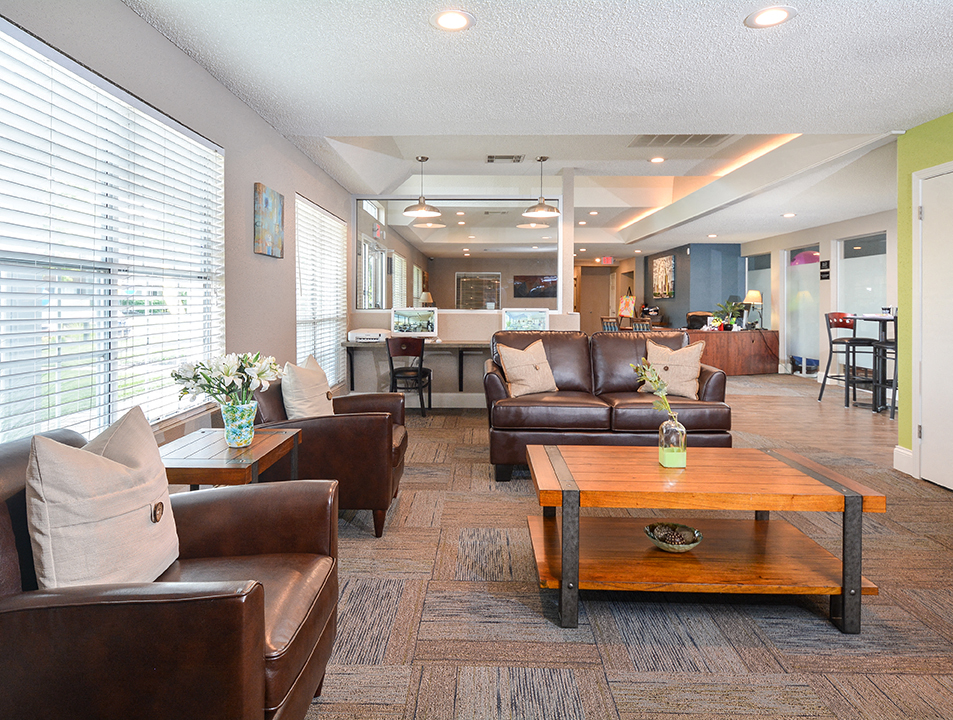 a living room with couches and a coffee table
