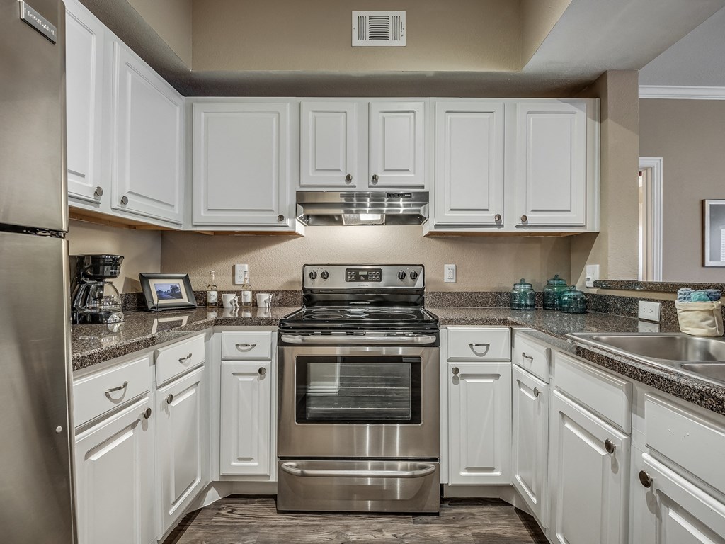 Kitchen with White Cabinetry and Stainless Steel Appliances