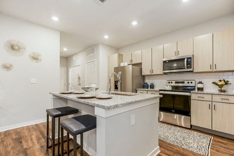 a kitchen with a counter top and a sink