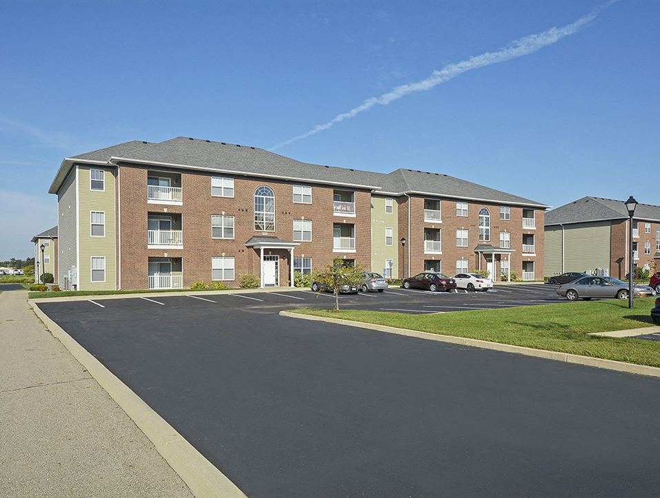 Exterior of a Towne Park Apartment Building with Parking