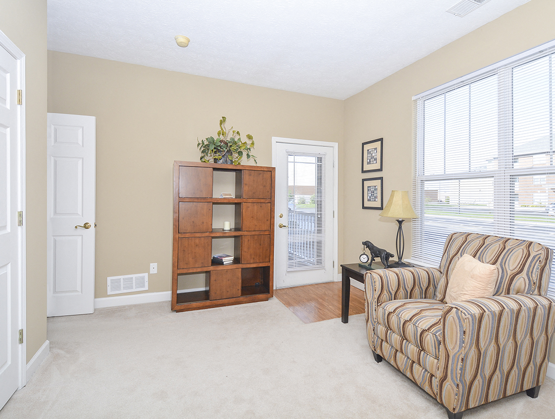 Bedroom with Large Windows and Balcony Access
