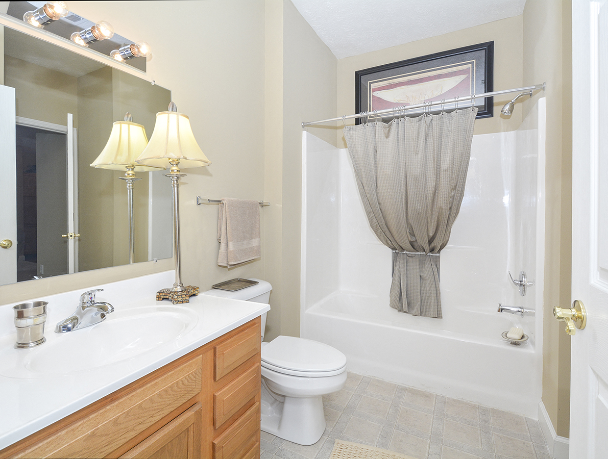 Full Sized Bathroom with Tile Style Flooring and Large Vanity