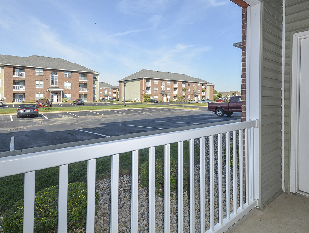 Exterior Patio Overlooking the Grass and Parking