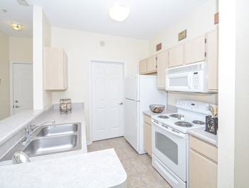 Fully-Equipped Kitchen with White Appliances