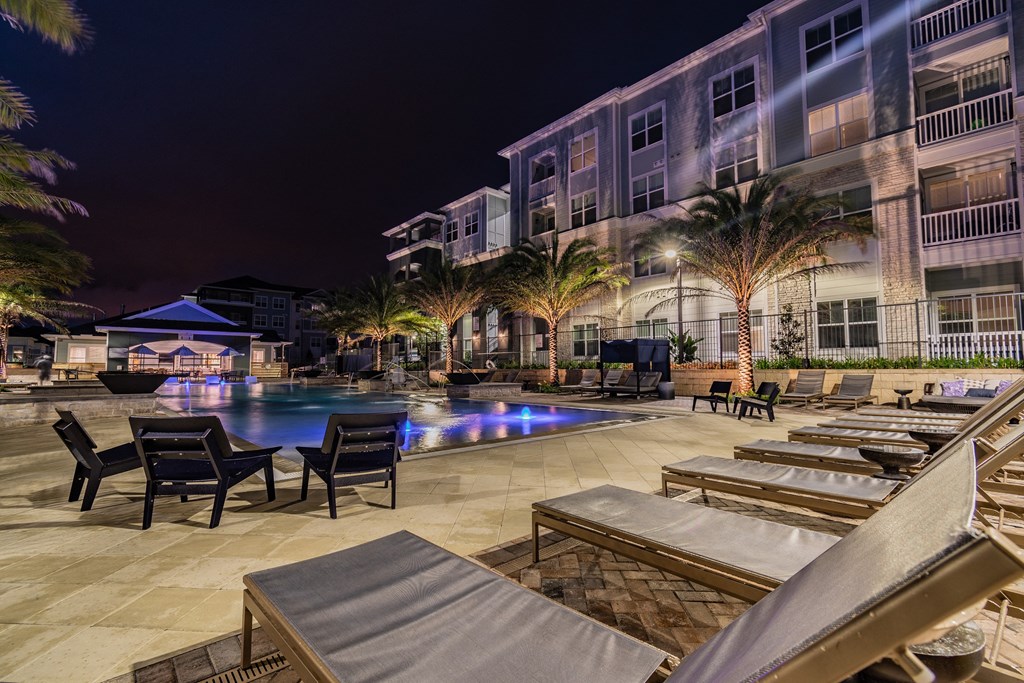 Resort-Style Pool & Sundeck Lit Up At Night