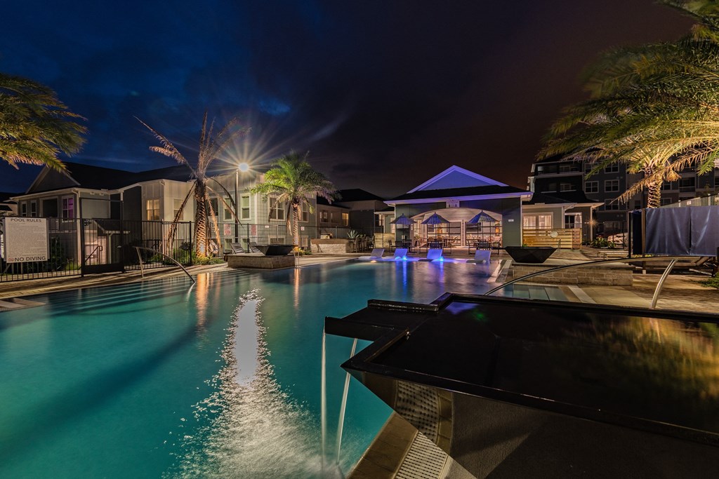 Resort-Style Pool Lit Up At Night