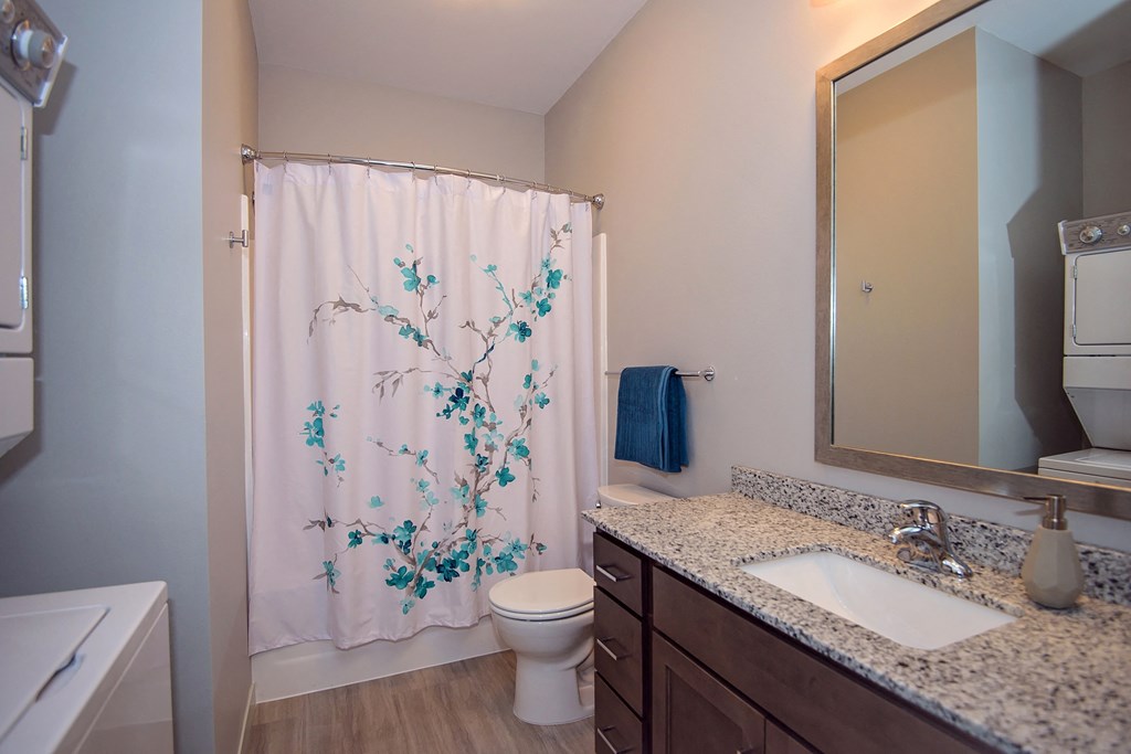 Bathroom with Stacked Washer and Dryer