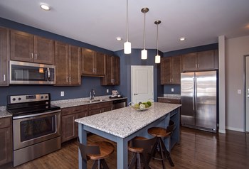 Kitchen with Stainless Steel Appliances and Pantry Closet - Photo Gallery 3