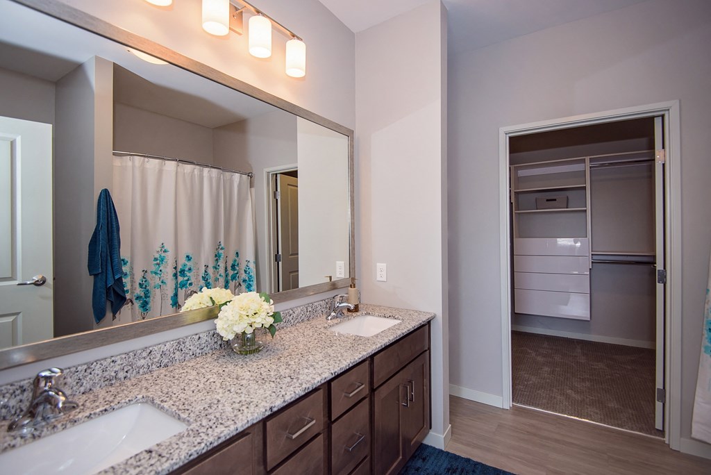 Large Bathroom Vanity with Granite Countertops and Dual Sinks
