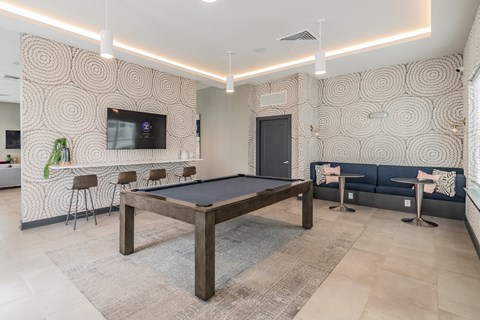 Pool Table With Adjacent Mounted Flat Screen