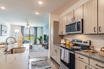 Kitchen Featuring Stainless Steel Appliances & Subway Tile Backsplash