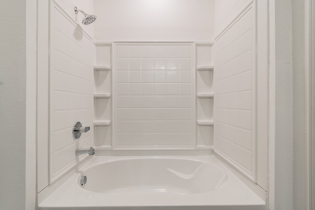 Tiled Shower With Built-In Shelving In The Shower