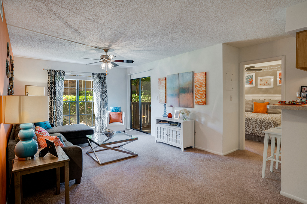 Spacious Living Room with Large Windows and Sliding Patio Door