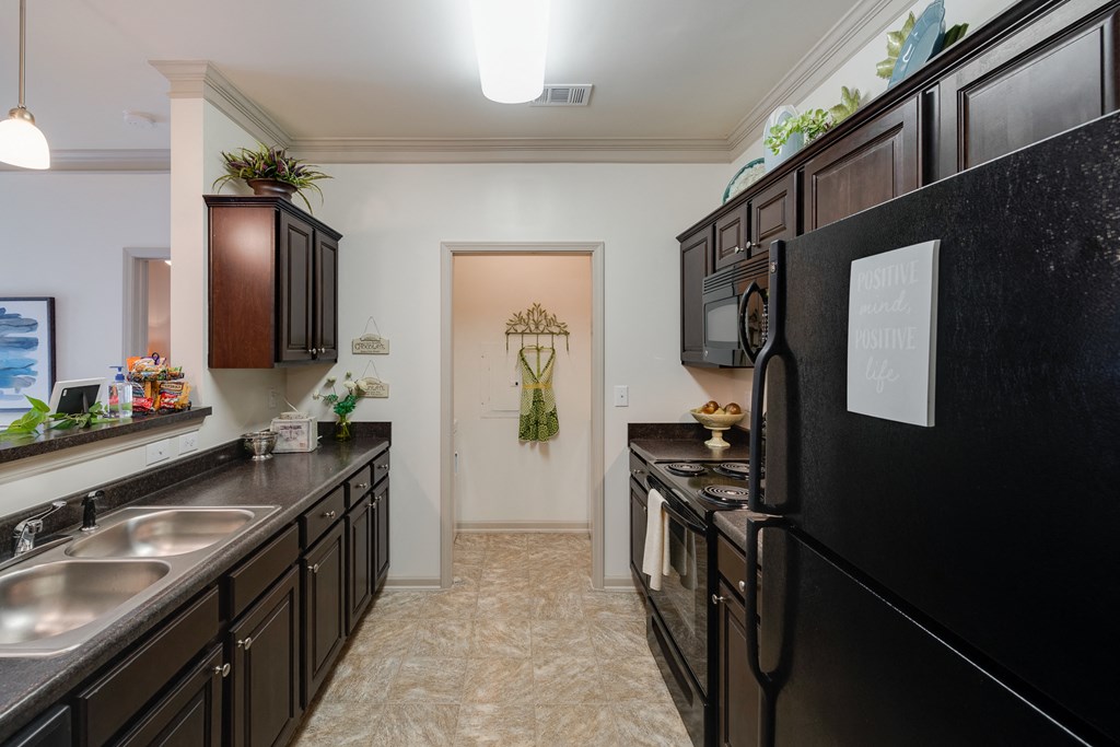 Galley Kitchen With Tiled-Style Flooring