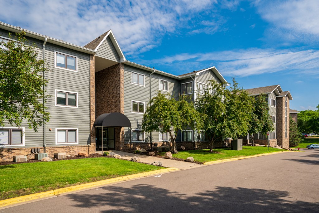 France 98 Apartment Homes Exterior With Brick & Green Siding