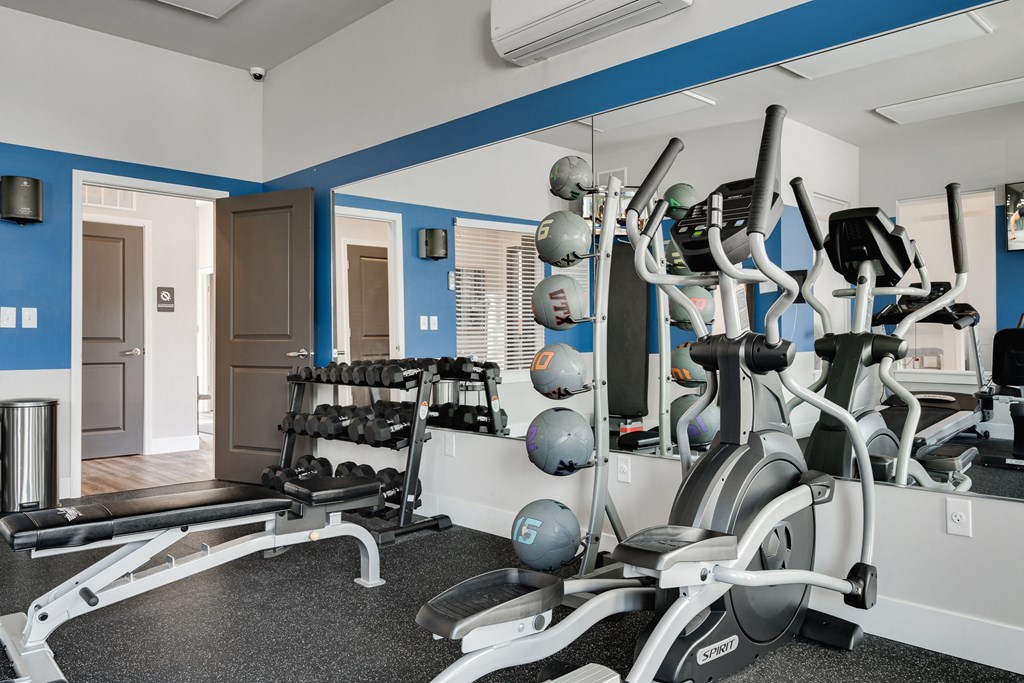 Elliptical & Free Weights At The Fitness Center