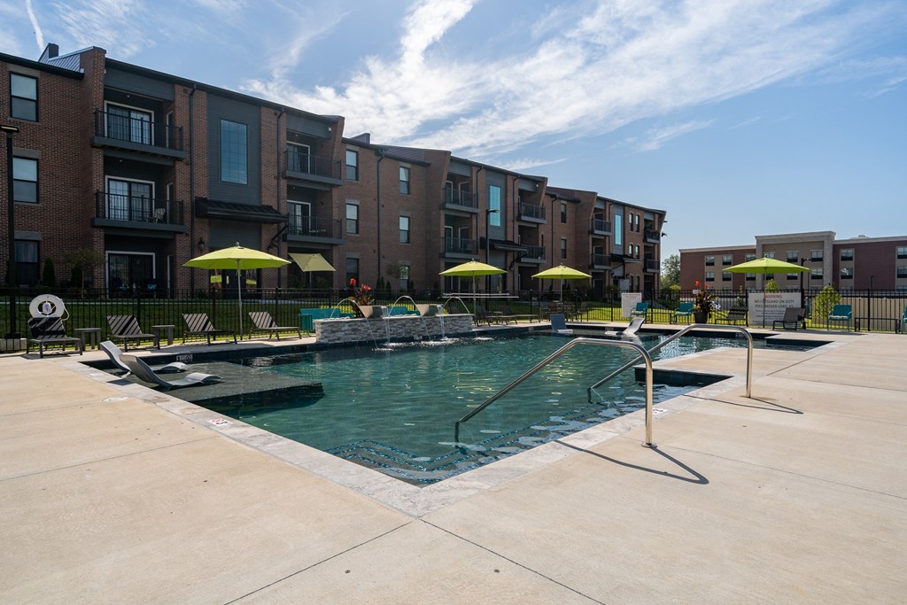Resort-Style Pool With Fountains & Sun Lounger Chairs