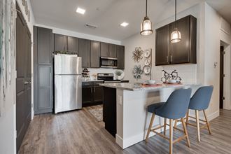 Kitchen With Granite Countertops & White Subway Tile Backsplash