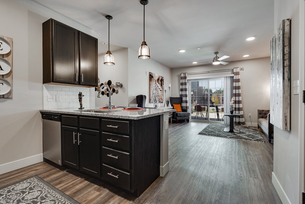 Large Kitchen Island With Granite Counters & Stainless Steel Dishwasher