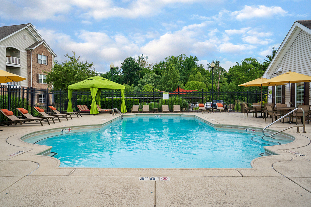 Pool Lounge Furniture with Cabana and Sun Umbrellas