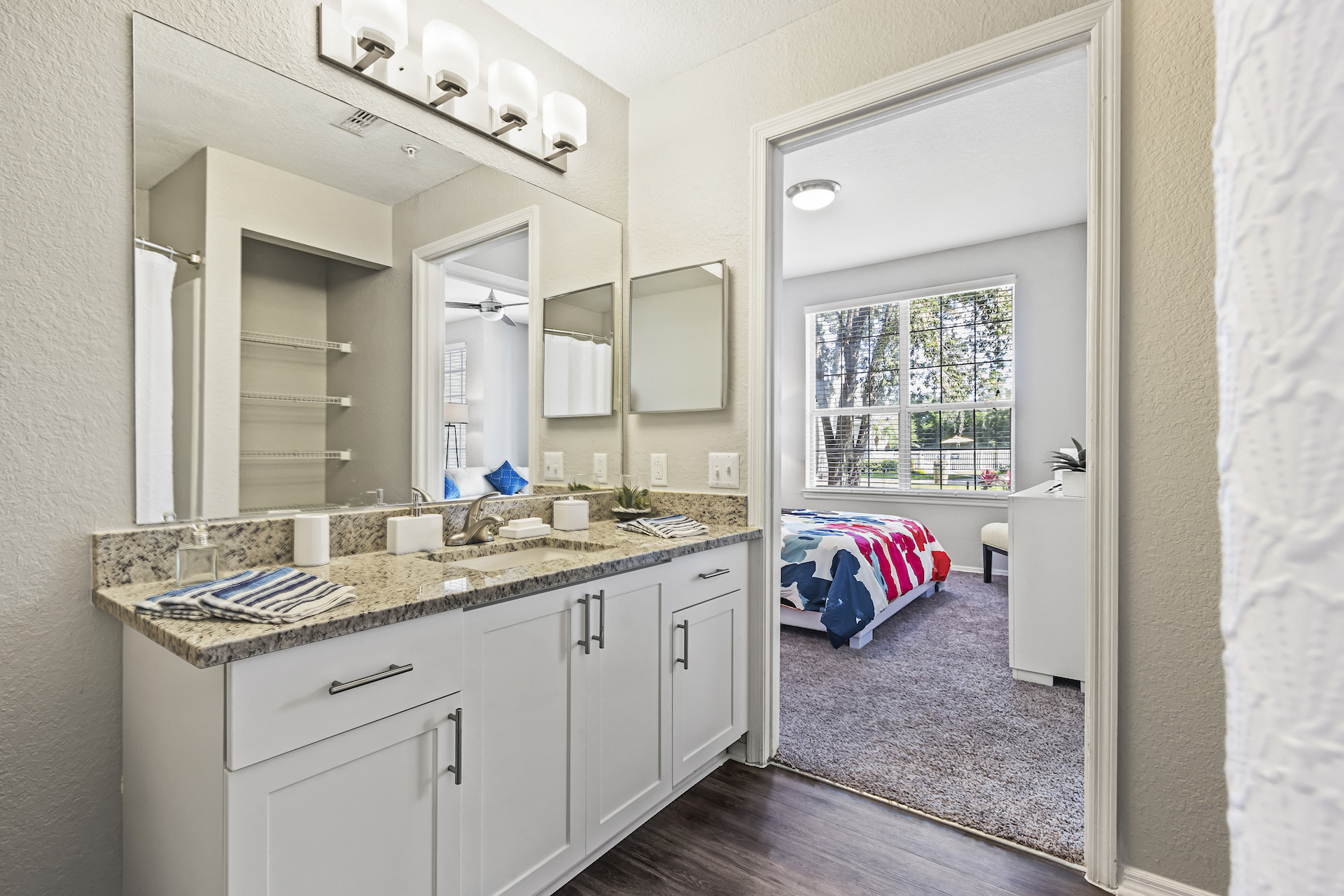 Bathroom with Large Vanity and Storage and Hardwood Style Flooring